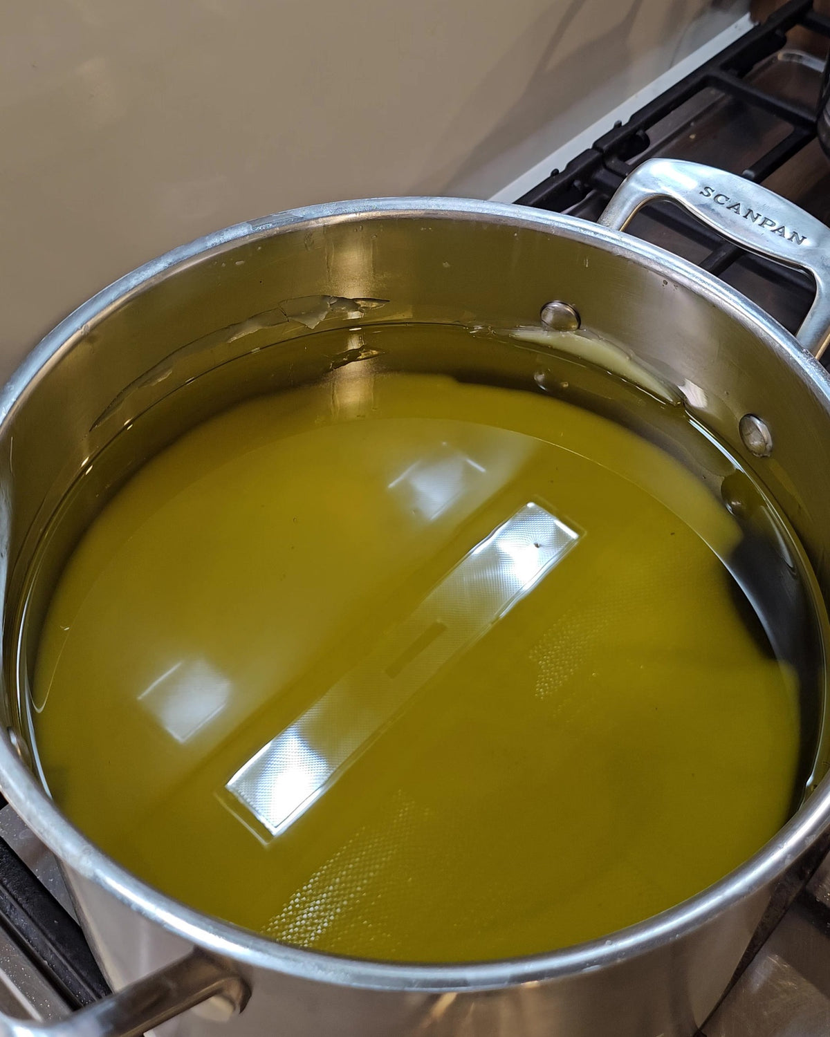 Australian grass-fed beef tallow being rendered in a stainless steel pot to make AusTallow balm