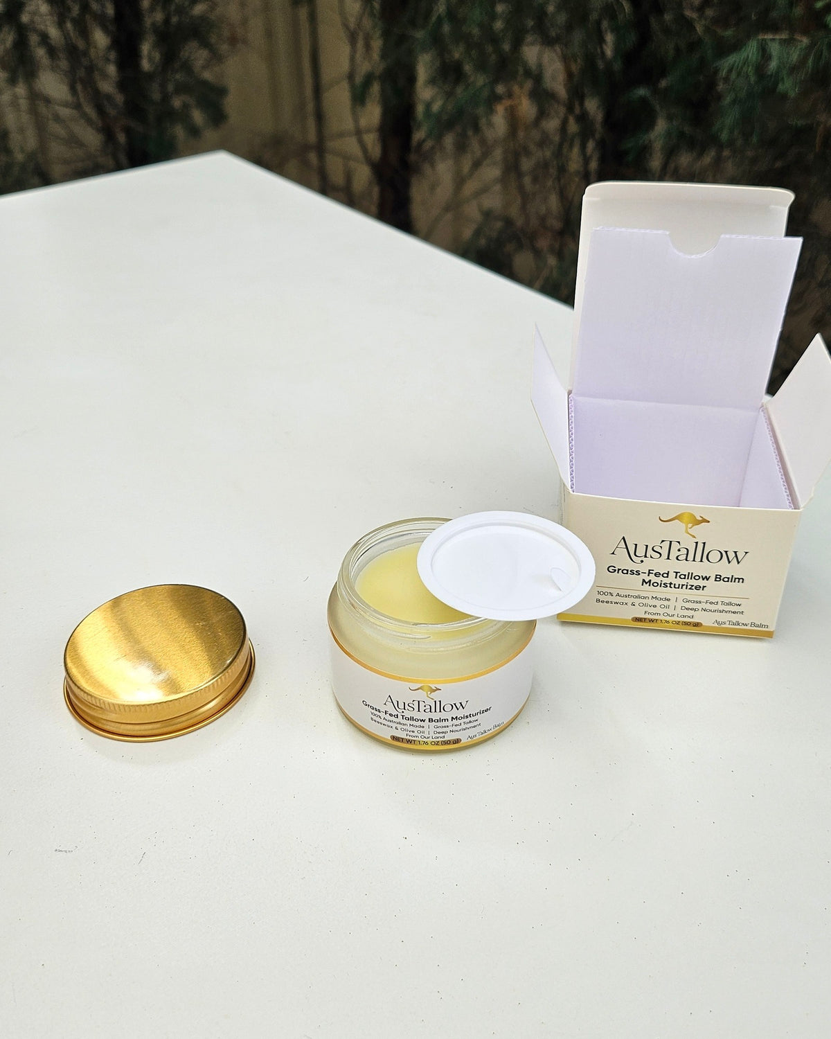 What arrives: AusTallow tallow balm 50g glass jar with gold metal lid, foil seal and printed box